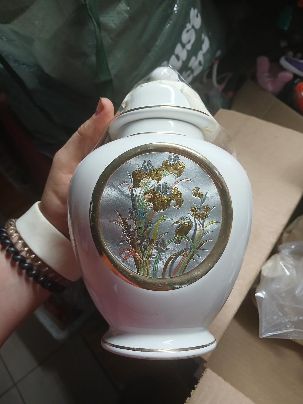 vintage Japanese white porcelain ginger jar featuring a metallic inlaid medallio